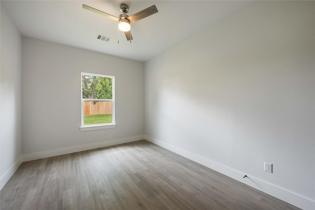 8221 Tower St, Houston, TX 77088 - spare room featuring baseboards, ceiling fan, and wood finished floors
