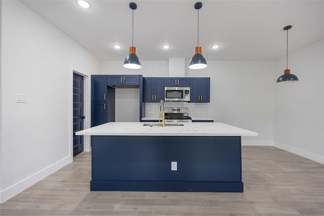 8221 Tower St, Houston, TX 77088 - kitchen with appliances with stainless steel finishes, a sink, baseboards, blue cabinets, and light stone counters