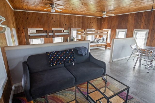 927 W Verdie Dr, Crystal Beach, TX 77650 - living room featuring ceiling fan, wooden walls, wood ceiling, and wood finished floors