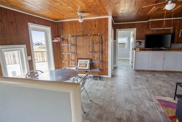 927 W Verdie Dr, Crystal Beach, TX 77650 - kitchen with wood ceiling, wooden walls, ornamental molding, hardwood / wood-style flooring, and a ceiling fan