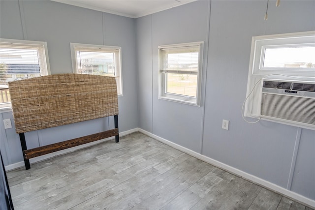 927 W Verdie Dr, Crystal Beach, TX 77650 - spare room with wood finished floors, healthy amount of natural light, and baseboards