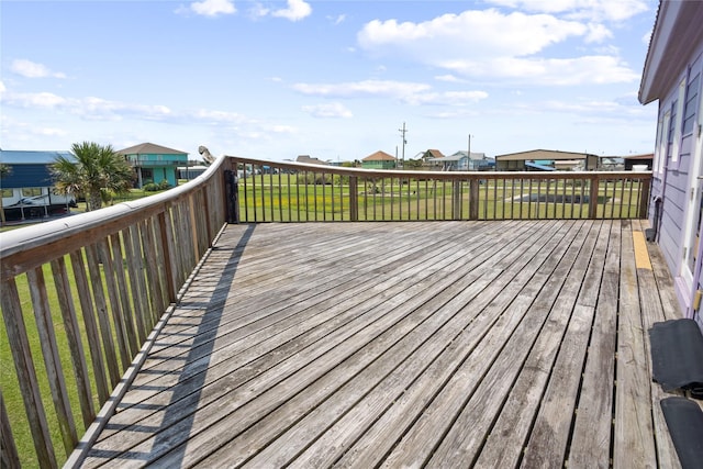 927 W Verdie Dr, Crystal Beach, TX 77650 - wooden deck featuring a lawn and a residential view