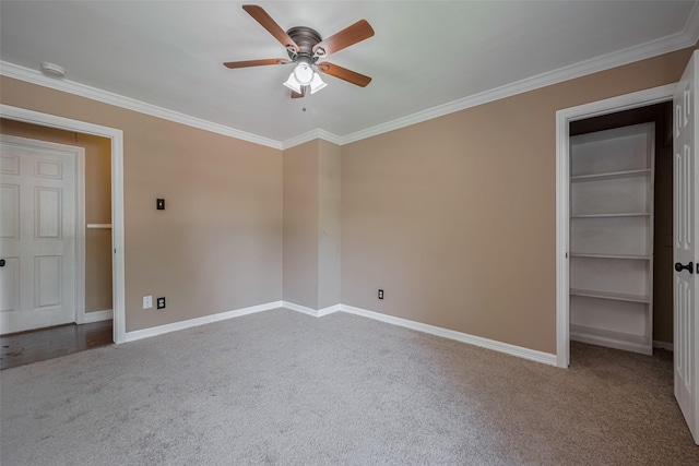 15509 Lakeview Dr, Jersey Village, TX 77040 - unfurnished bedroom featuring carpet flooring, baseboards, ornamental molding, a walk in closet, and ceiling fan