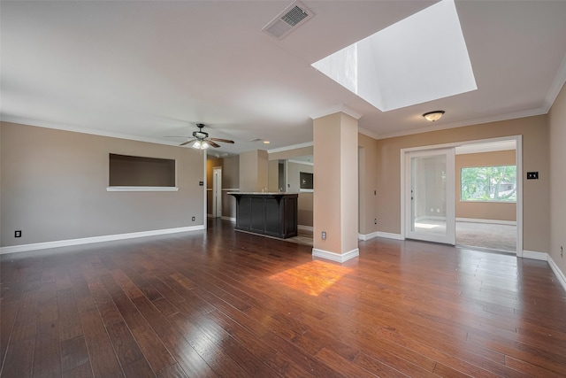 15509 Lakeview Dr, Jersey Village, TX 77040 - unfurnished living room with dark wood-type flooring, baseboards, ceiling fan, and crown molding