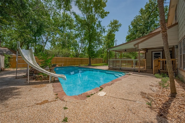 15509 Lakeview Dr, Jersey Village, TX 77040 - view of swimming pool featuring a water slide and a fenced backyard