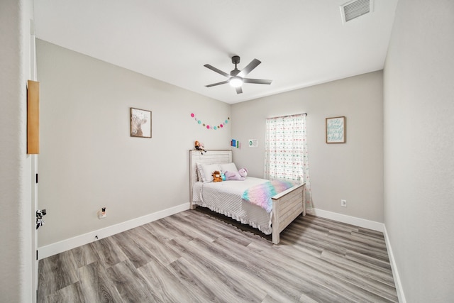 7332 Kurt Dr, Brenham, TX 77833 - bedroom with light wood-style floors, baseboards, and a ceiling fan