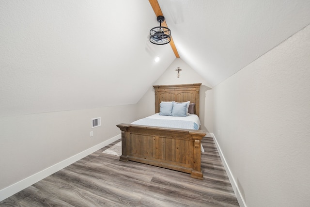 7332 Kurt Dr, Brenham, TX 77833 - bedroom featuring lofted ceiling, baseboards, and wood finished floors