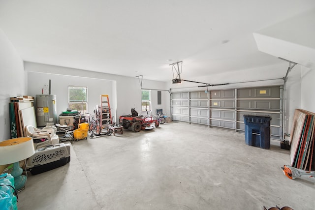7332 Kurt Dr, Brenham, TX 77833 - garage with electric water heater and a garage door opener