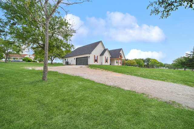 7332 Kurt Dr, Brenham, TX 77833 - view of front of home featuring dirt driveway, a front yard, board and batten siding, and a garage