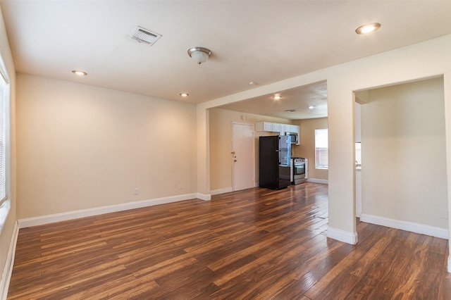 10601 Murr Way, Houston, TX 77048 - unfurnished living room with dark wood finished floors, baseboards, and recessed lighting