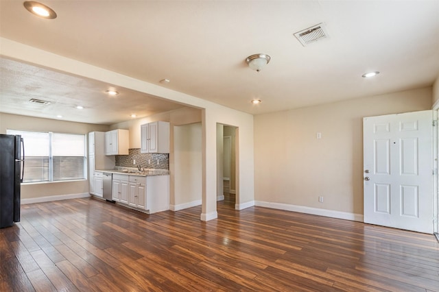 10601 Murr Way, Houston, TX 77048 - unfurnished living room featuring baseboards, a sink, dark wood-style floors, and recessed lighting