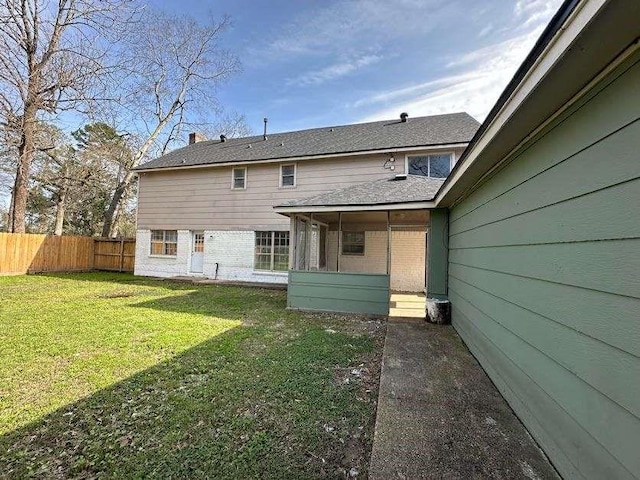 706 Redleaf Ln, Houston, TX 77090 - rear view of property with brick siding and a sunroom