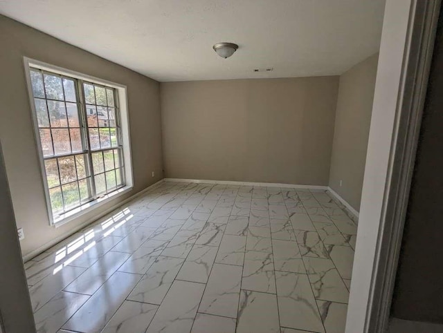 706 Redleaf Ln, Houston, TX 77090 - empty room with light marble finish floors and baseboards