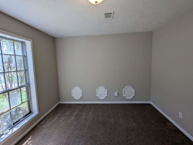 706 Redleaf Ln, Houston, TX 77090 - empty room with healthy amount of natural light, a textured ceiling, carpet, and baseboards
