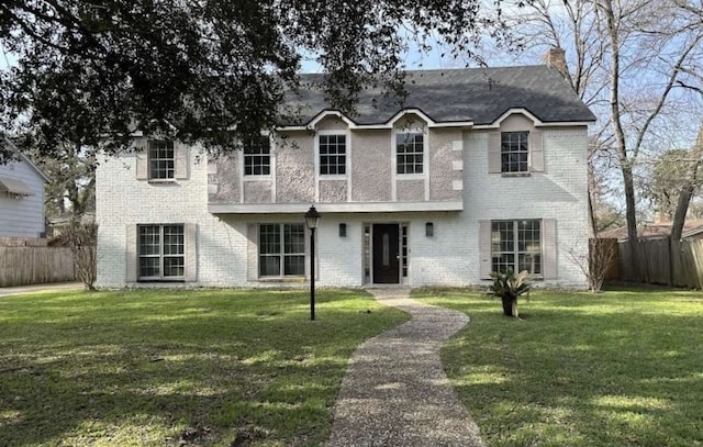 706 Redleaf Ln, Houston, TX 77090 - view of front of home with a chimney and brick siding