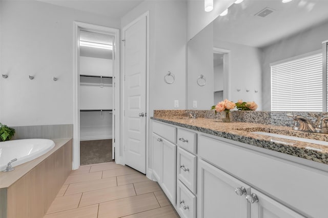 126 Capriccio Ln, Montgomery, TX 77316 - full bath featuring double vanity, a garden tub, and a spacious closet
