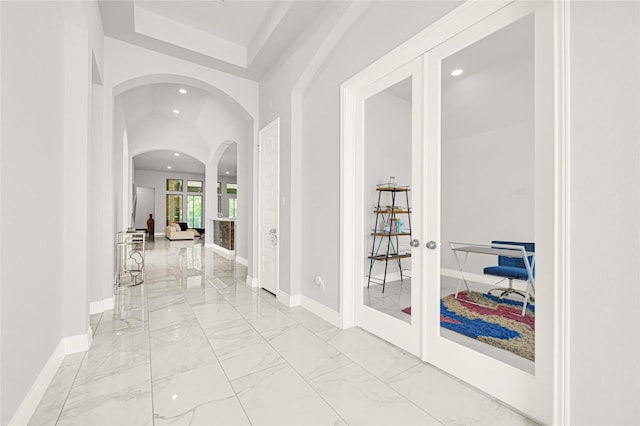 19236 Yellow Chestnut Ln, New Caney, TX 77357 - hall featuring recessed lighting, arched walkways, french doors, baseboards, and light marble finish floors