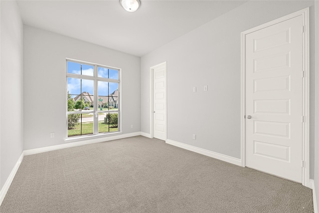 19236 Yellow Chestnut Ln, New Caney, TX 77357 - spare room featuring carpet flooring and baseboards