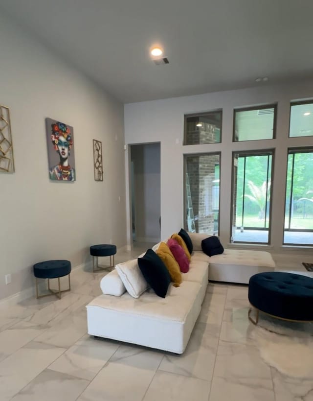 19236 Yellow Chestnut Ln, New Caney, TX 77357 - living room featuring light marble finish flooring and baseboards