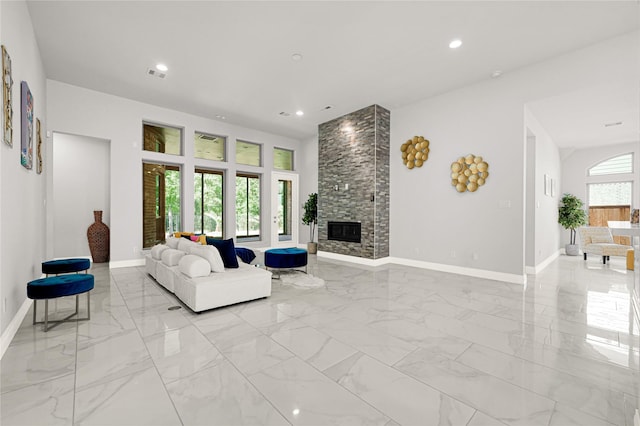 19236 Yellow Chestnut Ln, New Caney, TX 77357 - living room featuring baseboards, light marble finish floors, a large fireplace, and recessed lighting