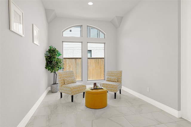 19236 Yellow Chestnut Ln, New Caney, TX 77357 - living area featuring marble look tiles, baseboards, and vaulted ceiling