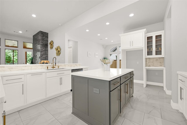 19236 Yellow Chestnut Ln, New Caney, TX 77357 - kitchen featuring a sink, light marble finish flooring, recessed lighting, white cabinetry, and gray cabinets