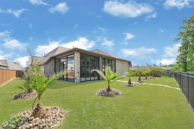 19236 Yellow Chestnut Ln, New Caney, TX 77357 - rear view of property featuring a sunroom