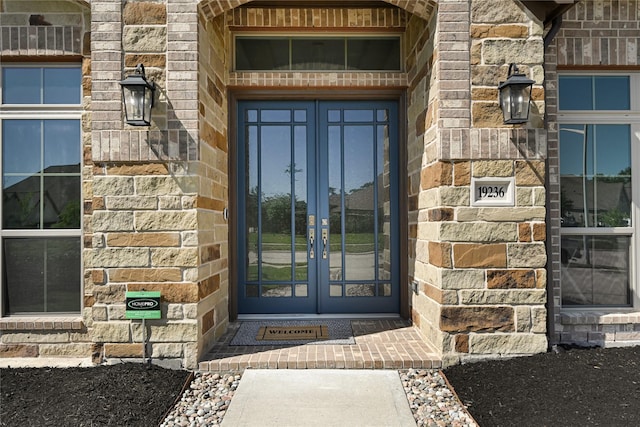 19236 Yellow Chestnut Ln, New Caney, TX 77357 - entrance to property featuring french doors and stone siding
