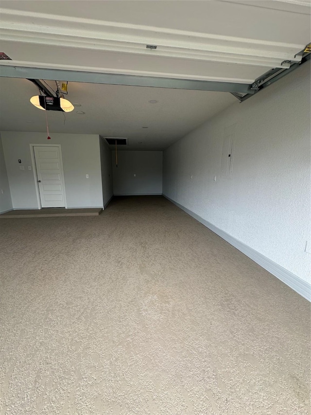 19236 Yellow Chestnut Ln, New Caney, TX 77357 - garage featuring a garage door opener and baseboards