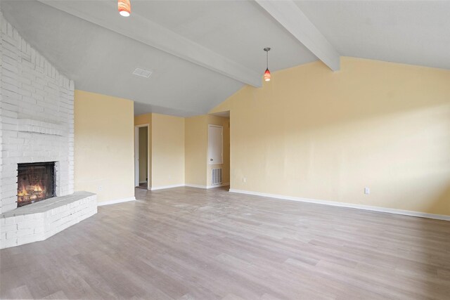 14118 Magnolia Springs Dr, Houston, TX 77066 - unfurnished living room with wood finished floors, a brick fireplace, and baseboards