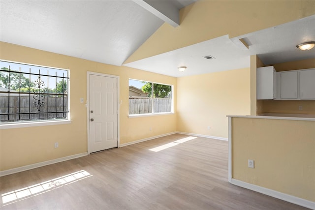 14118 Magnolia Springs Dr, Houston, TX 77066 - unfurnished living room with light wood-style flooring and baseboards