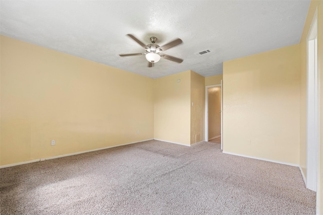 14118 Magnolia Springs Dr, Houston, TX 77066 - unfurnished room with ceiling fan, carpet floors, baseboards, and a textured ceiling
