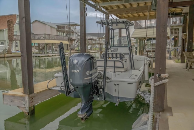 22113 Matagorda Dr, Galveston, TX 77554 - dock featuring boat lift and a water view