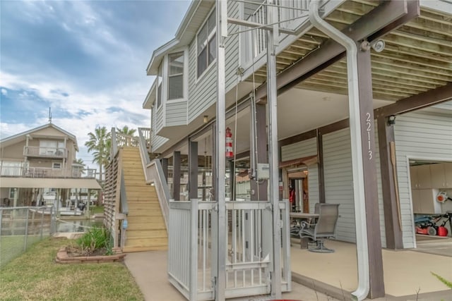 22113 Matagorda Dr, Galveston, TX 77554 - view of home's exterior featuring stairway