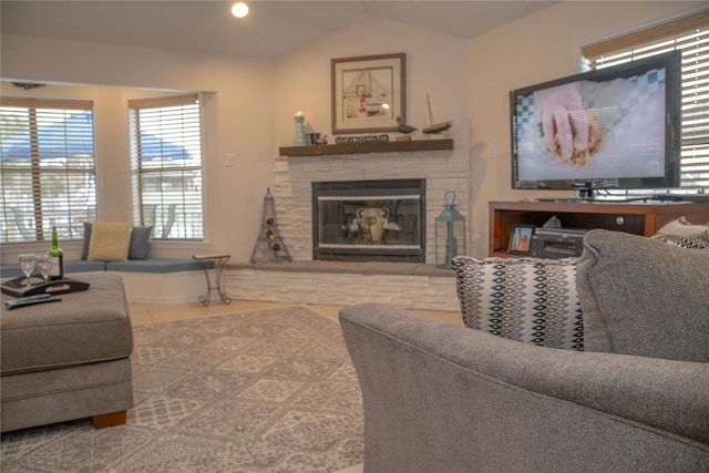 22113 Matagorda Dr, Galveston, TX 77554 - living room with vaulted ceiling, a stone fireplace, recessed lighting, and tile patterned floors