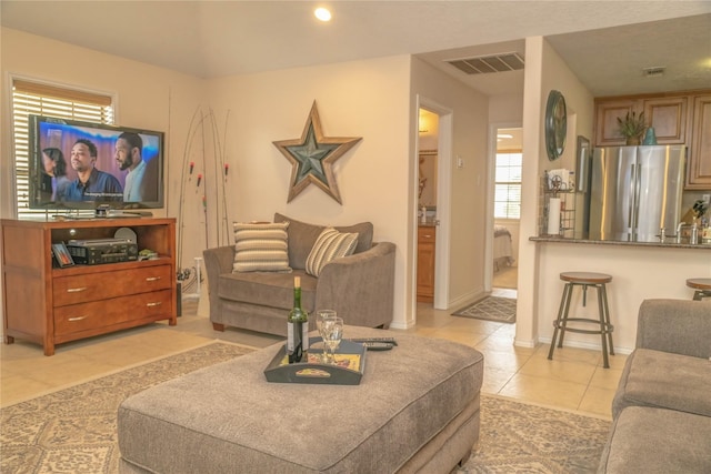 22113 Matagorda Dr, Galveston, TX 77554 - living room featuring light tile patterned floors, baseboards, and recessed lighting