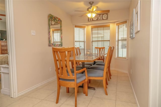 22113 Matagorda Dr, Galveston, TX 77554 - dining room featuring ceiling fan, baseboards, and light tile patterned floors