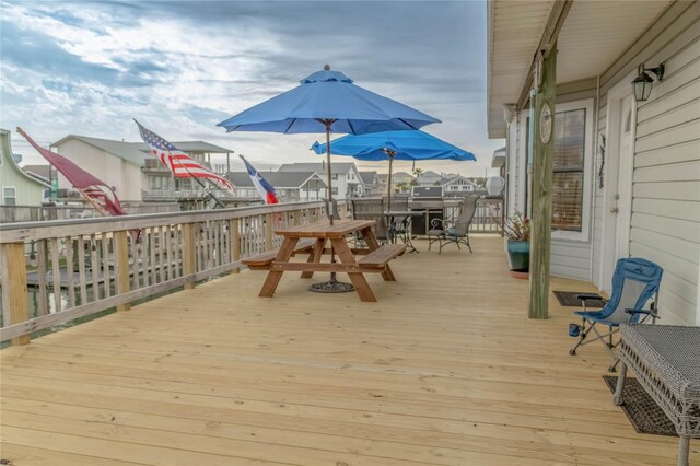 22113 Matagorda Dr, Galveston, TX 77554 - wooden terrace featuring outdoor dining area