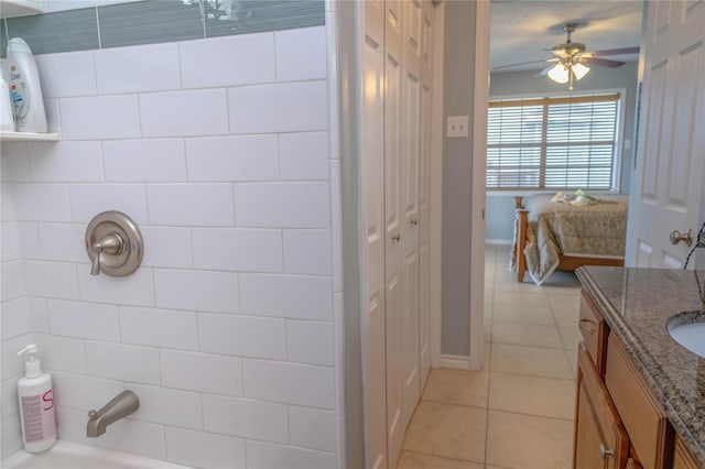 22113 Matagorda Dr, Galveston, TX 77554 - full bath with vanity, tile patterned flooring, ceiling fan, shower / tub combination, and baseboards