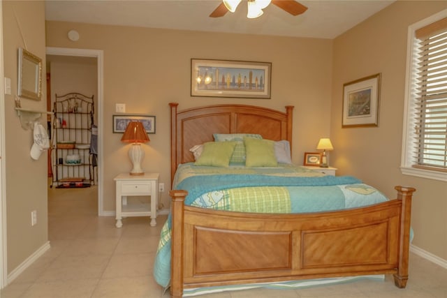 22113 Matagorda Dr, Galveston, TX 77554 - bedroom featuring light tile patterned floors, baseboards, and ceiling fan