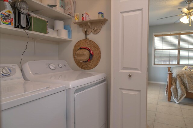 22113 Matagorda Dr, Galveston, TX 77554 - laundry area featuring washer and dryer, ceiling fan, light tile patterned flooring, and baseboards