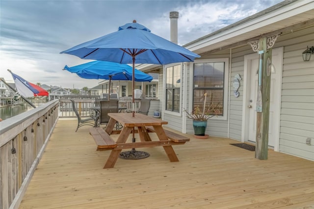 22113 Matagorda Dr, Galveston, TX 77554 - wooden deck featuring outdoor dining space