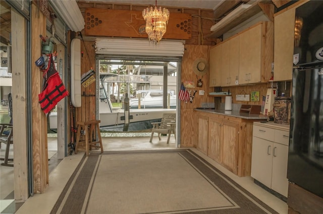 22113 Matagorda Dr, Galveston, TX 77554 - kitchen with freestanding refrigerator, a chandelier, and pendant lighting