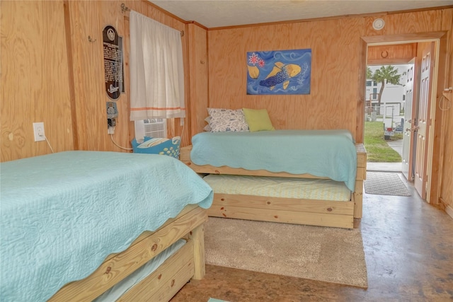 22113 Matagorda Dr, Galveston, TX 77554 - bedroom featuring wood walls and concrete flooring