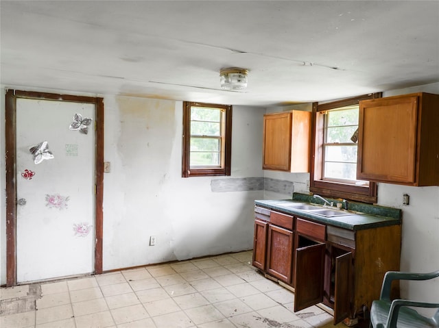3200 Moore Ave, Bay City, TX 77414 - kitchen with a sink and brown cabinetry