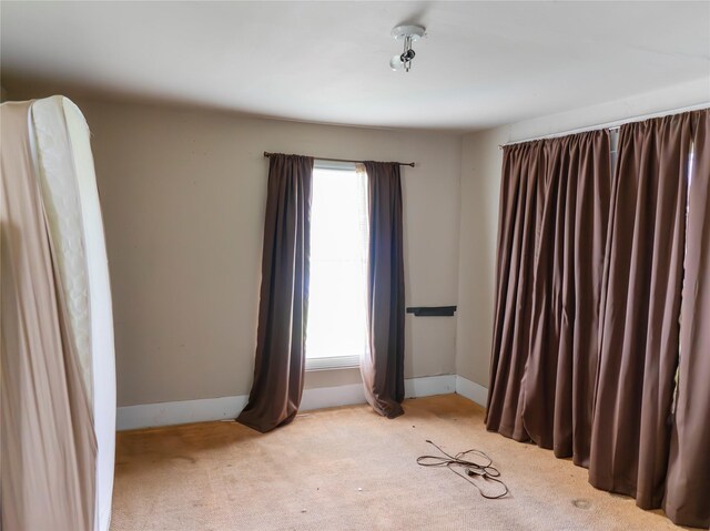 3200 Moore Ave, Bay City, TX 77414 - carpeted spare room with plenty of natural light and baseboards