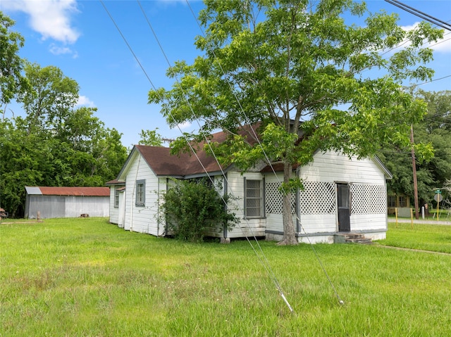 3200 Moore Ave, Bay City, TX 77414 - view of property exterior featuring a lawn