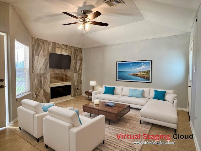 5306 Deborah Ln, Baytown, TX 77521 - tiled living area with ceiling fan, baseboards, and a fireplace