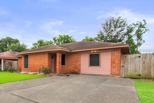 8726 Tilgham St, Houston, TX 77029 - ranch-style house featuring brick siding and a patio area