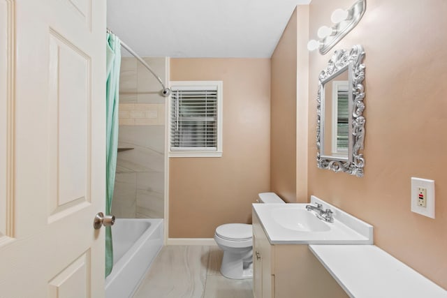 8726 Tilgham St, Houston, TX 77029 - full bath with vanity, toilet, shower / bath combo with shower curtain, baseboards, and marble finish flooring